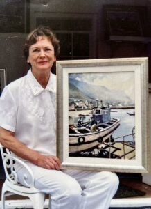 Heather with one of her paintings