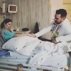 Fawn & Travis sitting together in one of the many hospital stays